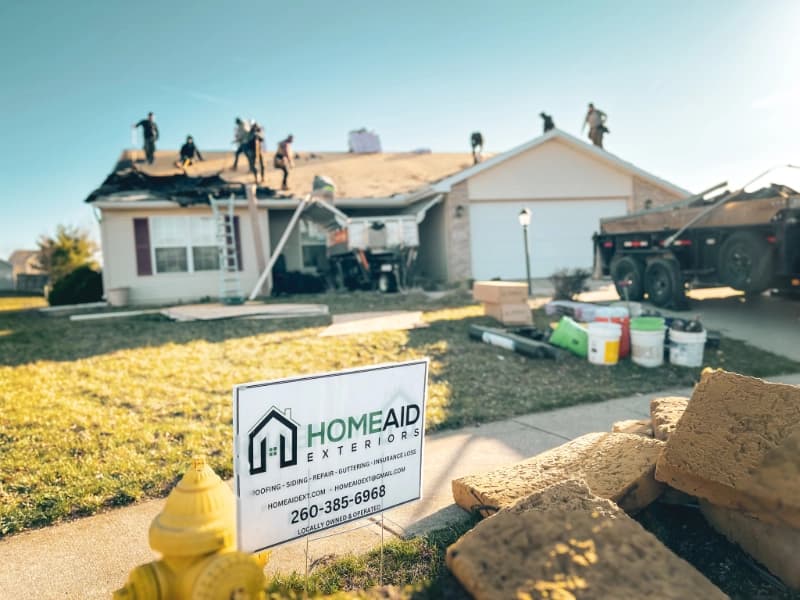 Home Aid Exteriors roofing crew on a job site in Fort Wayne