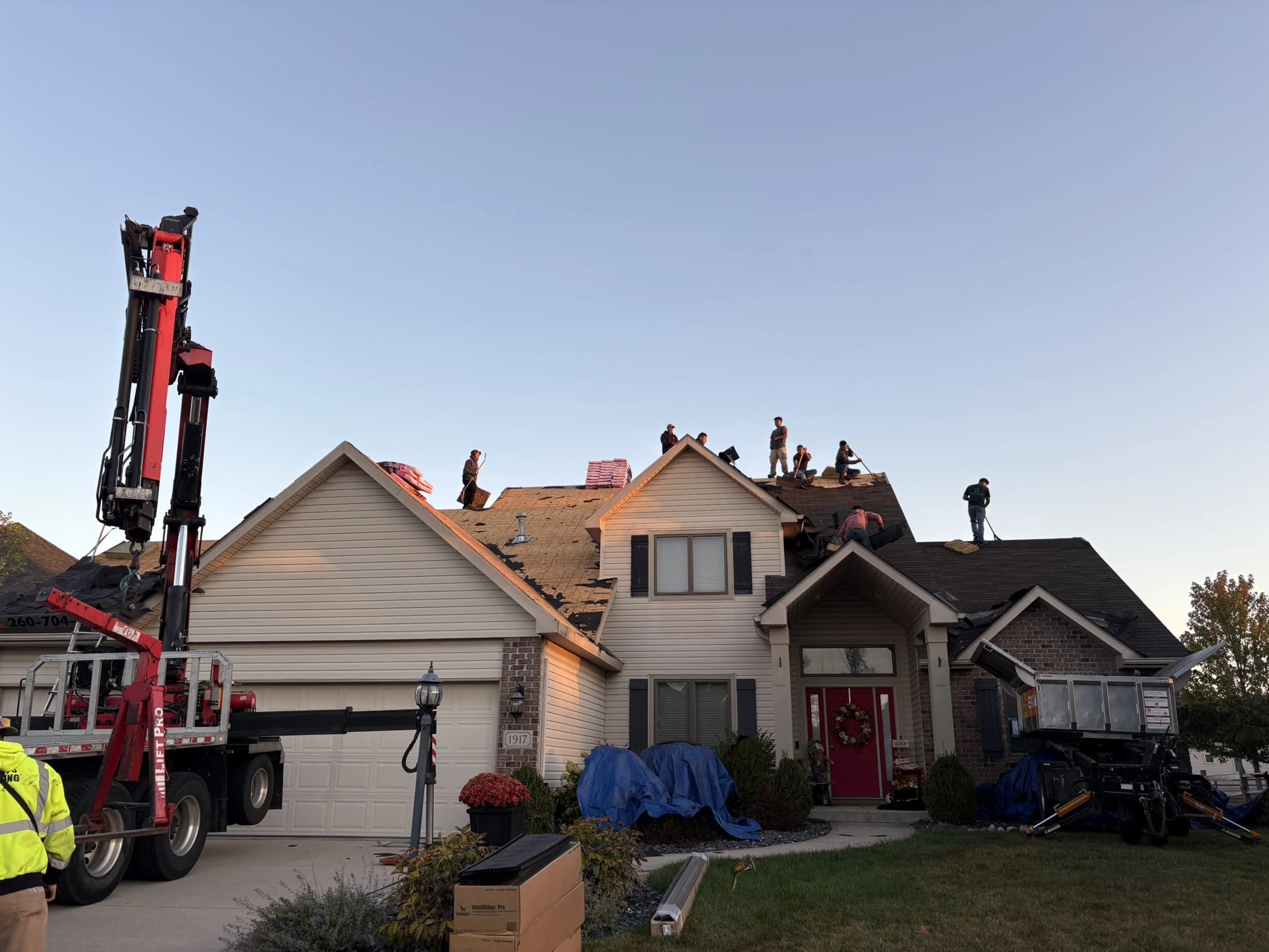 HomeAid Exteriors crew replacing a storm-damaged roof on a Fort Wayne home